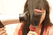 The woman doing a coiffure