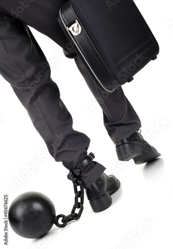 Photo: Ball and chain on businessman Ball and chain on businessman