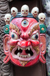 Colorful Buddhist mask on a temple wall