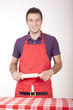 Photo: Young attractive male cook in apron Young attractive male cook in apron