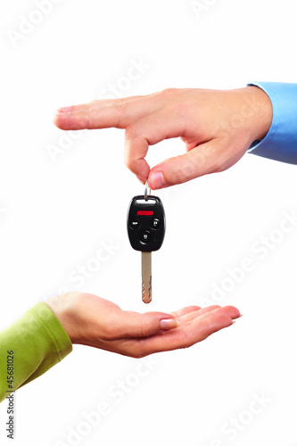 Photo: Hand with a car key. Hand with a car key.