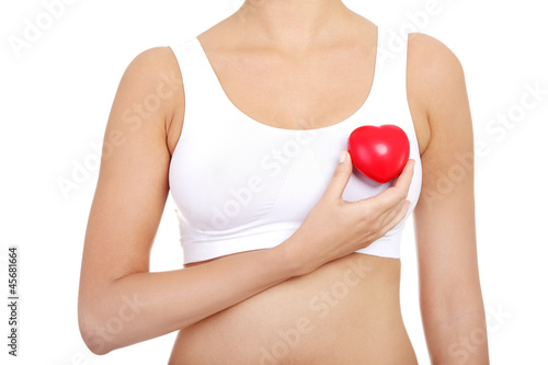 Photo: Fit female torso with red heart shaped toy Fit female torso with red heart shaped toy