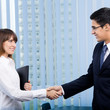 Happy businesspeople handshaking