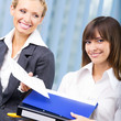 Businesswomen with documents at office