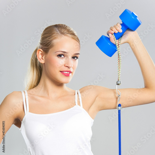 Photo: Woman with dumbbell and growth Woman with dumbbell and growth