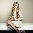 Portrait of a beautiful young woman with a handbag