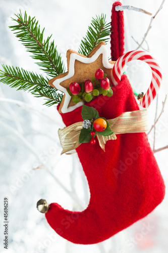 Photo: Christmas stocking with gifts Christmas stocking with gifts