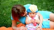 Mother and her cute baby girl play outdoor