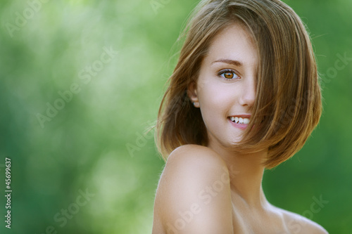 Photo: smiling beautiful young woman close up smiling beautiful young woman close up