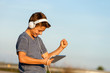 Happy boy listening to music on digital tablet.