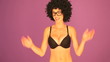 Woman with afro pulling faces