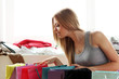 Happy woman checking shopping bags