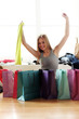 Happy woman checking shopping bags