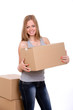 Young woman carrying cardboard boxes
