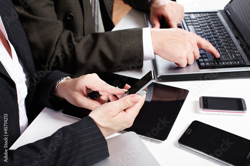 Photo: Business people group working with laptop. Business people group working with laptop.