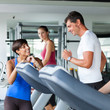 People Running on Treadmill in the Gym