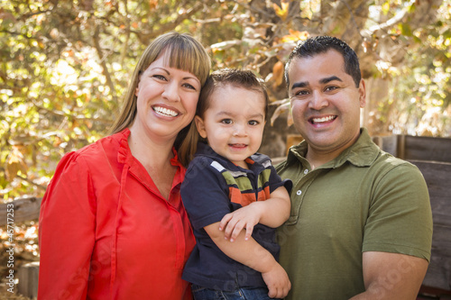 Photo: Happy Mixed Race Family Posing for A Portrait Happy Mixed Race Family Posing for A Portrait