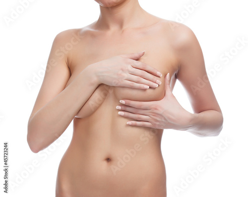 Photo: Cropped image of a female controlling breast for cancer Cropped image of a female controlling breast for cancer