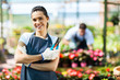 pretty female nursery worker portrait with pruner