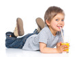 Little boy drinking orange juice
