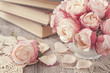 Pink roses and old books