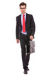 serious fashion business man walking forward
