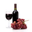 Photo: Full red wine glass goblet, bottle and grapes Full red wine glass goblet, bottle and grapes