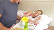 Man Bringing Woman Breakfast In Bed