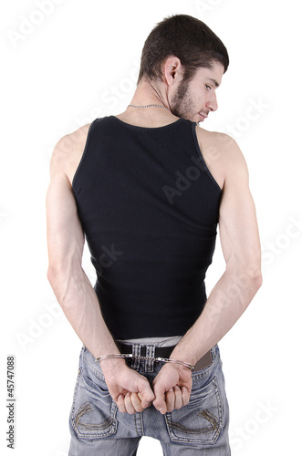 Photo: Young criminal in handcuffs Young criminal in handcuffs