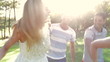 Group Of Friends Running Along Country Path