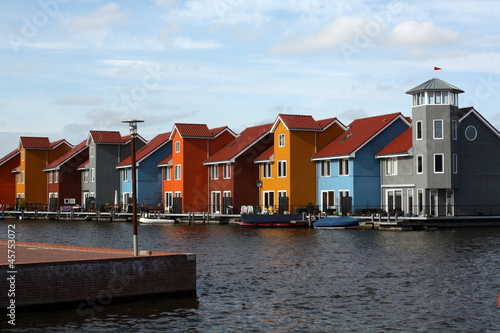Photo: Colored houses on the waterfront in Groningen.Netherlands Colored houses on the waterfront in Groningen.Netherlands