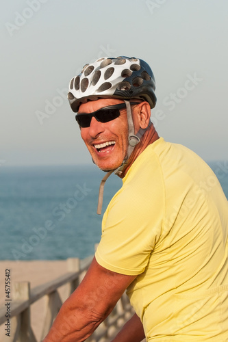 Photo: Smiling man wearing a cycling helmet Smiling man wearing a cycling helmet