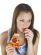 Photo: thoughtful teenage girl eating pizza thoughtful teenage girl eating pizza