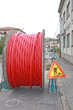 Foto: roadworks and a coil of wire with the excavation roadworks and a coil of wire with the excavation