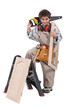 Young boy pretending to be a carpenter