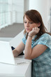Brunette teenager concentrating on computer screen