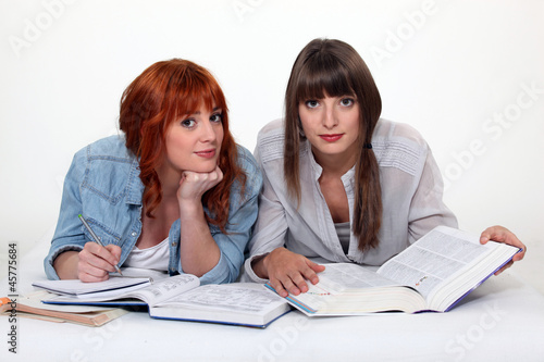 Photo: Two university students revising for exam Two university students revising for exam