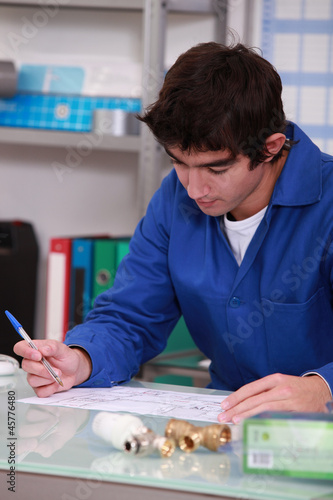 Photo: young man in workshop young man in workshop