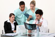 young physician surrounded by male and female nurse