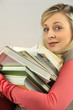 Woman with pile of books