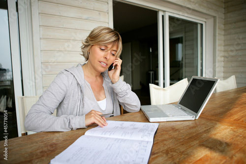 Photo: Woman working at home Woman working at home