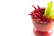 Sweet green chili and red hot chili in wooden mortar
