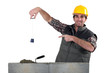 a builder pointing a lead