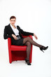 Woman sitting in red chair