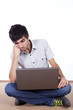Photo: Happy young man surfing the internet Happy young man surfing the internet