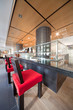 Bar in sushi restaurant with red chairs, indoor