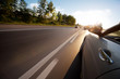Photo: Car ride on road in sunny weather, motion blur Car ride on road in sunny weather, motion blur
