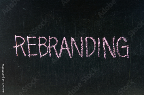 Photo: The word REBRANDING handwritten with chalk on a blackboard The word REBRANDING handwritten with chalk on a blackboard