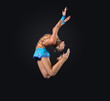 Young woman in gymnast suit posing