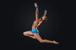 Young woman in gymnast suit posing